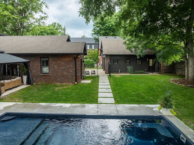 1702 Stokes Ln, Nashville, TN 37215 - rear view of property featuring brick siding, an outdoor pool, a shingled roof, and a gazebo