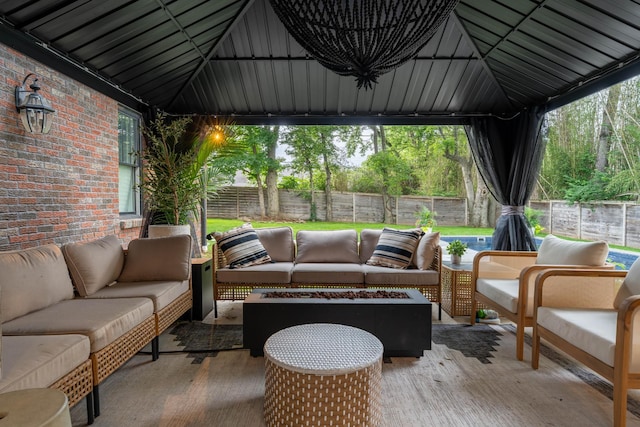 1702 Stokes Ln, Nashville, TN 37215 - fenced backyard with an outdoor living space with a fire pit, a patio, and a gazebo