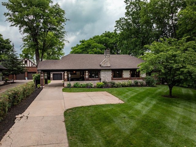 1702 Stokes Ln, Nashville, TN 37215 - view of front of property with a front lawn, stone siding, a chimney, and roof with shingles