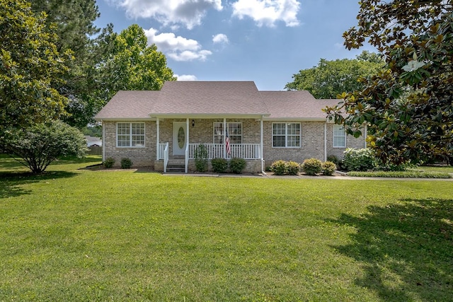 1077 Kathryn Rd, Mount Juliet, TN 37122 - view of front of house with covered porch, a front yard, brick siding, and a shingled roof