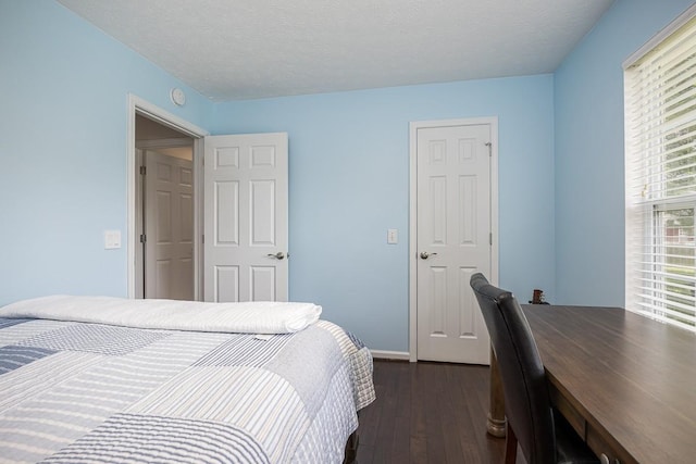 1077 Kathryn Rd, Mount Juliet, TN 37122 - bedroom with dark wood-style floors, baseboards, and a textured ceiling