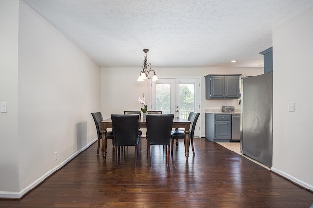 1077 Kathryn Rd, Mount Juliet, TN 37122 - dining room featuring baseboards, dark wood-style floors, a chandelier, and a textured ceiling