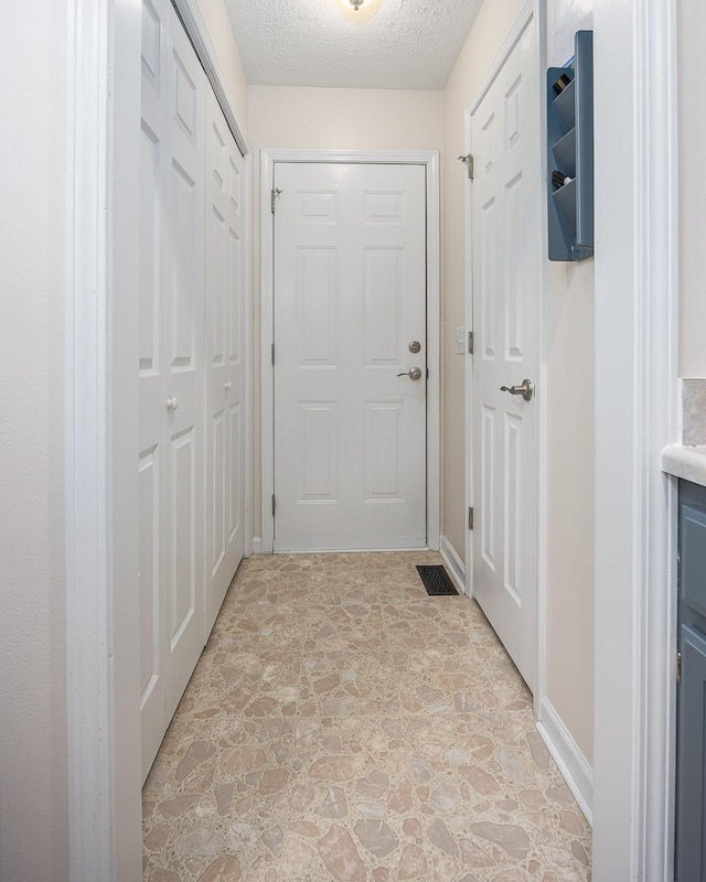 1077 Kathryn Rd, Mount Juliet, TN 37122 - doorway to outside featuring stone floors and a textured ceiling