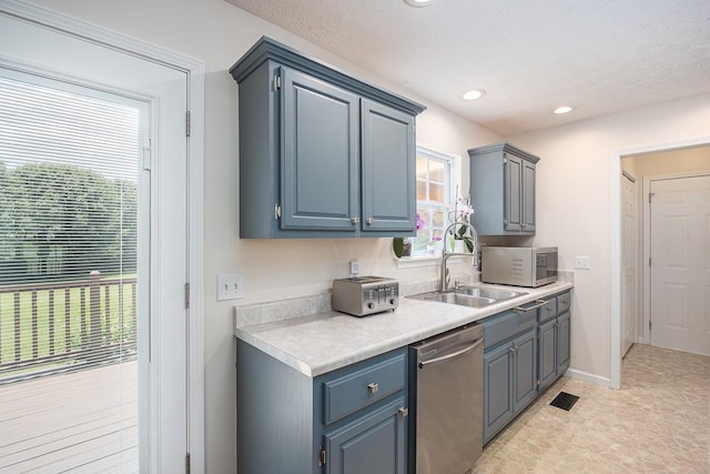 1077 Kathryn Rd, Mount Juliet, TN 37122 - kitchen with stainless steel dishwasher, a sink, light countertops, white microwave, and recessed lighting