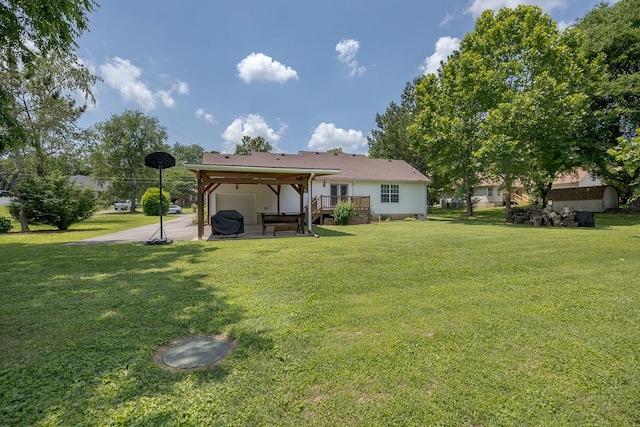 1077 Kathryn Rd, Mount Juliet, TN 37122 - rear view of house featuring a yard, a patio, and a wooden deck