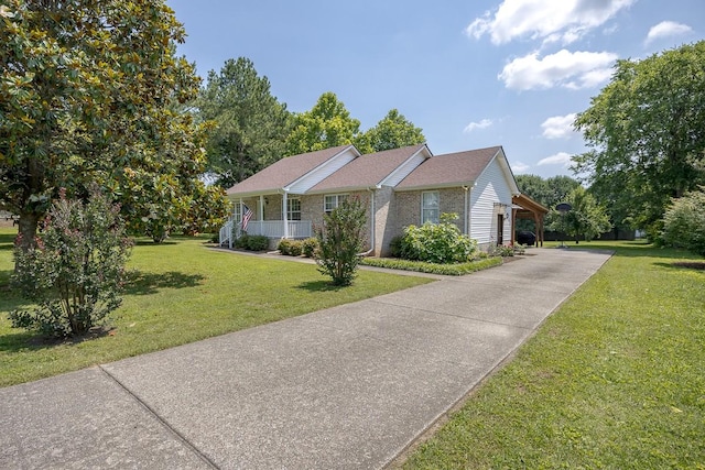 1077 Kathryn Rd, Mount Juliet, TN 37122 - ranch-style home featuring a front yard, driveway, covered porch, and brick siding
