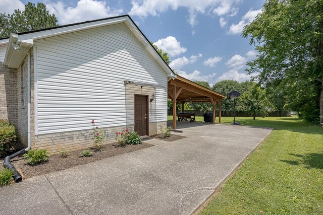 1077 Kathryn Rd, Mount Juliet, TN 37122 - view of home's exterior with a yard, a patio, and a carport