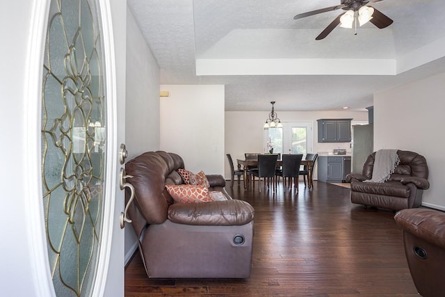 1077 Kathryn Rd, Mount Juliet, TN 37122 - living room featuring ceiling fan, dark wood finished floors, a textured ceiling, a tray ceiling, and a chandelier
