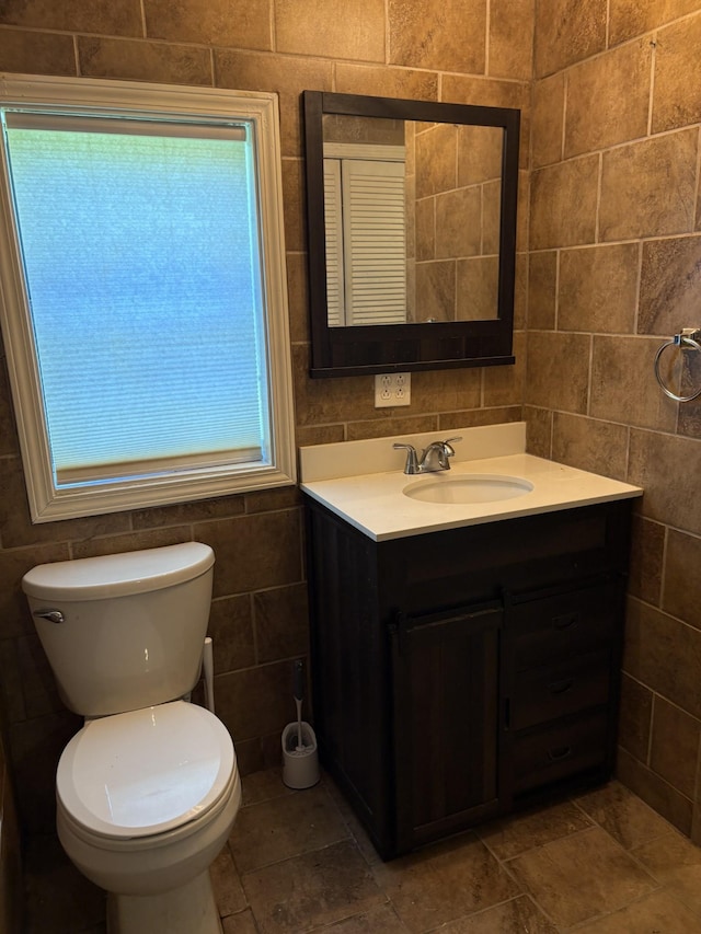 117 Rob Rd, Clarksville, TN 37040 - half bathroom with tile walls, vanity, and toilet