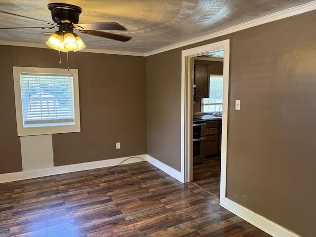 117 Rob Rd, Clarksville, TN 37040 - empty room with dark wood finished floors, a ceiling fan, baseboards, and crown molding