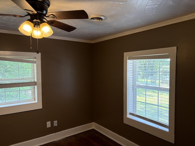 117 Rob Rd, Clarksville, TN 37040 - spare room featuring baseboards, dark wood-style flooring, ornamental molding, and a ceiling fan