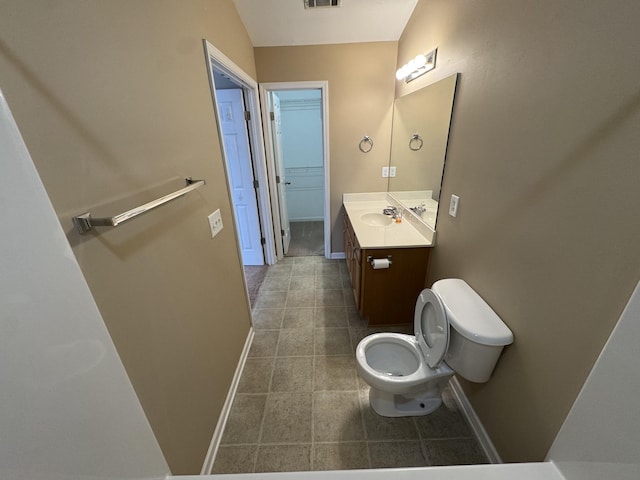 1101 Downs Blvd Unit 312, Franklin, TN 37064 - bathroom with vanity, toilet, baseboards, and tile patterned floors