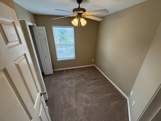 1101 Downs Blvd Unit 312, Franklin, TN 37064 - empty room featuring dark colored carpet, a ceiling fan, and baseboards