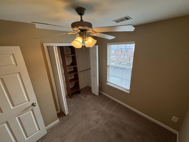 1101 Downs Blvd Unit 312, Franklin, TN 37064 - unfurnished bedroom featuring carpet, a closet, baseboards, and ceiling fan
