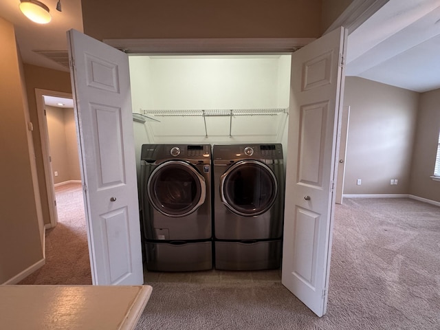 1101 Downs Blvd Unit 312, Franklin, TN 37064 - laundry area featuring carpet flooring, washer and clothes dryer, and baseboards