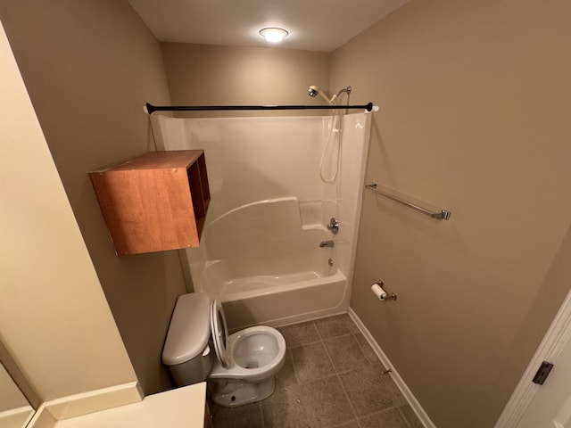 1101 Downs Blvd Unit 312, Franklin, TN 37064 - bathroom featuring toilet, washtub / shower combination, tile patterned flooring, and baseboards