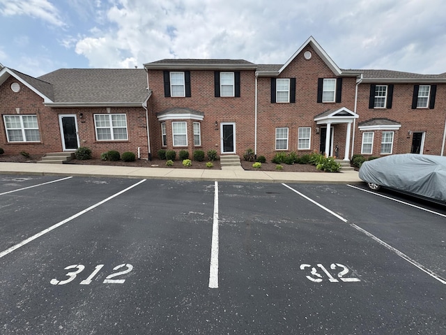 1101 Downs Blvd Unit 312, Franklin, TN 37064 - view of property featuring uncovered parking and brick siding