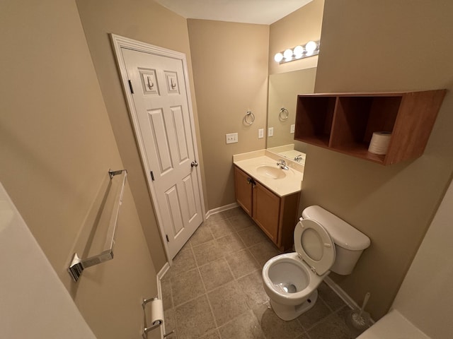 1101 Downs Blvd Unit 312, Franklin, TN 37064 - bathroom with toilet, vanity, baseboards, and tile patterned flooring