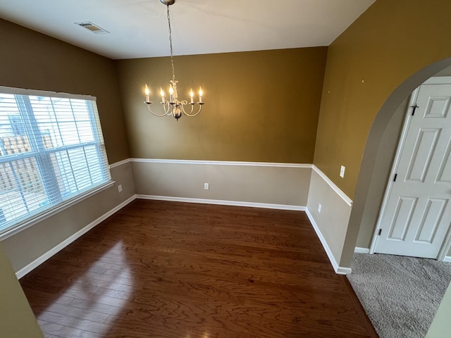 1101 Downs Blvd Unit 312, Franklin, TN 37064 - unfurnished dining area with arched walkways, a chandelier, dark wood-style flooring, and baseboards