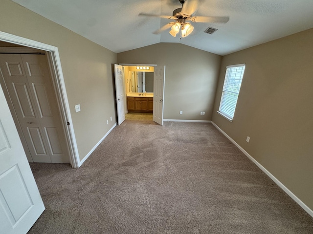 1101 Downs Blvd Unit 312, Franklin, TN 37064 - unfurnished bedroom with lofted ceiling, carpet flooring, baseboards, and connected bathroom
