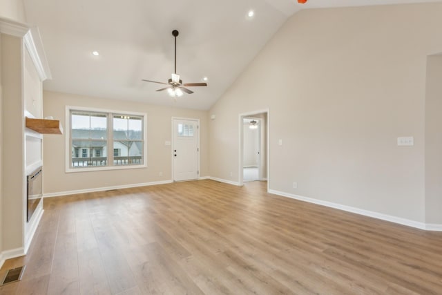 1445 Isaiah Dr, Clarksville, TN 37042 - unfurnished living room featuring a ceiling fan, light wood-style flooring, baseboards, high vaulted ceiling, and recessed lighting