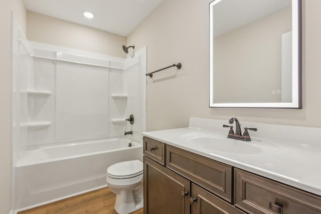 1445 Isaiah Dr, Clarksville, TN 37042 - full bathroom with vanity, toilet, wood finished floors, washtub / shower combination, and recessed lighting
