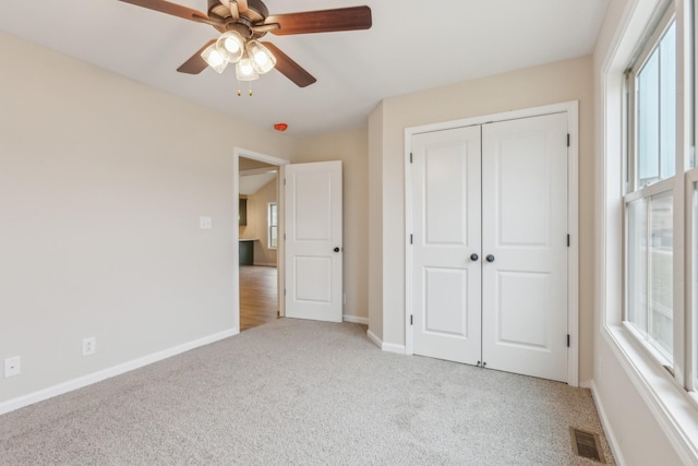 1445 Isaiah Dr, Clarksville, TN 37042 - unfurnished bedroom with carpet flooring, baseboards, a closet, and a ceiling fan