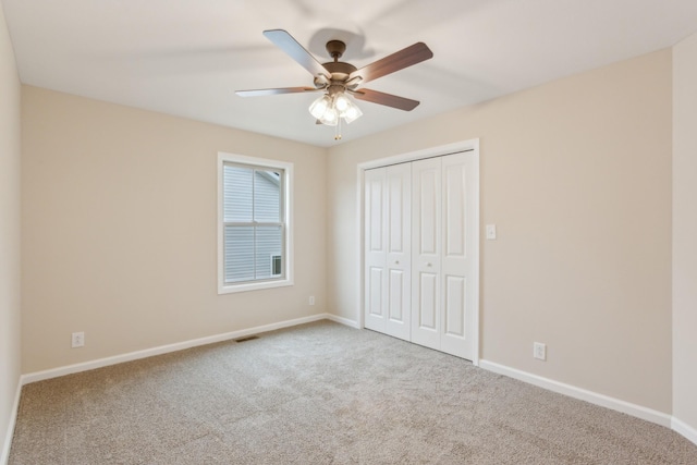 1445 Isaiah Dr, Clarksville, TN 37042 - unfurnished bedroom with carpet floors, baseboards, a closet, and ceiling fan