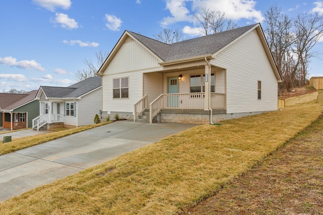 1445 Isaiah Dr, Clarksville, TN 37042 - view of front of property featuring covered porch, a shingled roof, a front lawn, crawl space, and board and batten siding