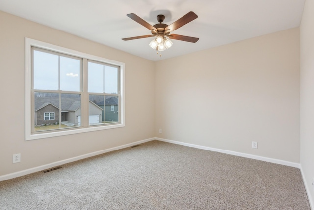 1445 Isaiah Dr, Clarksville, TN 37042 - spare room featuring carpet, baseboards, and ceiling fan
