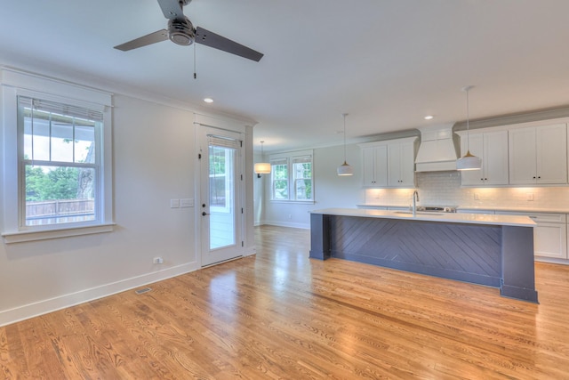 3104 Southlake Dr, Nashville, TN 37211 - kitchen featuring custom range hood, baseboards, light countertops, ceiling fan, and light wood-type flooring