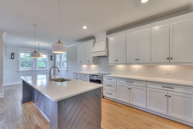 3104 Southlake Dr, Nashville, TN 37211 - kitchen featuring stainless steel electric range oven, a sink, custom exhaust hood, light countertops, and recessed lighting