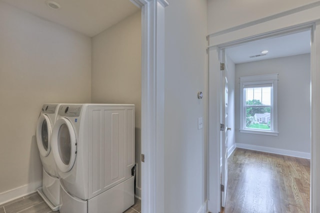 3104 Southlake Dr, Nashville, TN 37211 - laundry room featuring washer and clothes dryer, wood finished floors, and baseboards