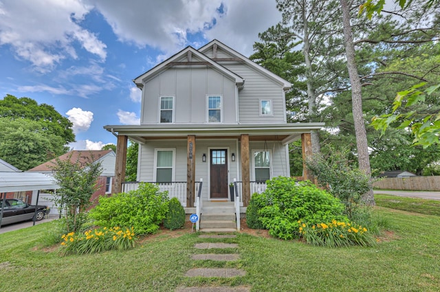 3104 Southlake Dr, Nashville, TN 37211 - view of front of house with board and batten siding, a porch, and a front lawn