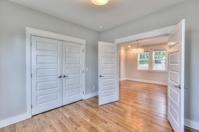 3104 Southlake Dr, Nashville, TN 37211 - unfurnished bedroom with baseboards, light wood-style flooring, and a closet