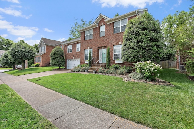 503 Hollyhock Way, Franklin, TN 37064 - view of front of house with concrete driveway, brick siding, and an attached garage
