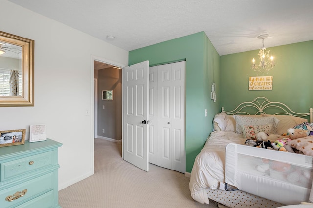 503 Hollyhock Way, Franklin, TN 37064 - bedroom featuring a chandelier, light colored carpet, a closet, and baseboards