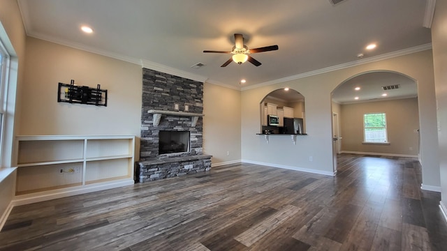 1060 Brayden Dr, Fairview, TN 37062 - living area featuring ceiling fan, arched walkways, dark wood-type flooring, a fireplace, and baseboards