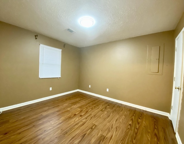 120 Holloway Dr, Lebanon, TN 37087 - unfurnished room with wood finished floors, baseboards, and a textured ceiling