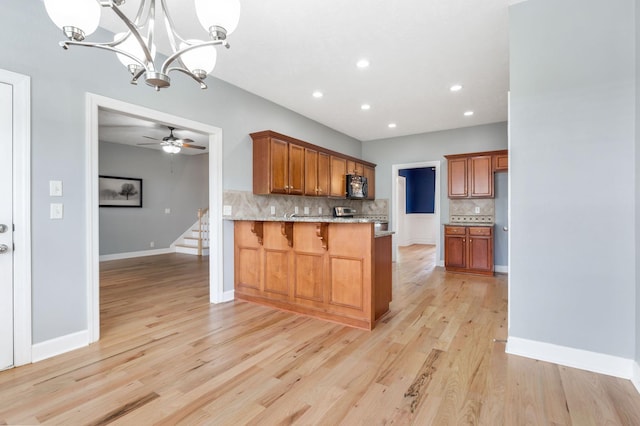 193 Red Jacket Trce, Murfreesboro, TN 37127 - kitchen featuring black microwave, tasteful backsplash, light wood-style floors, brown cabinets, and recessed lighting