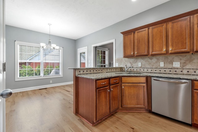 193 Red Jacket Trce, Murfreesboro, TN 37127 - kitchen with dishwasher, brown cabinets, light wood-style flooring, and a sink
