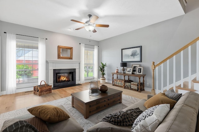 193 Red Jacket Trce, Murfreesboro, TN 37127 - living room with ceiling fan, light wood-style floors, a fireplace with flush hearth, stairway, and baseboards