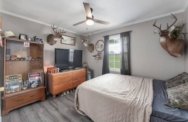 235 Pinecrest Dr, Henderson, TN 38340 - bedroom featuring ornamental molding, wood finished floors, and a ceiling fan