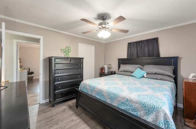 235 Pinecrest Dr, Henderson, TN 38340 - bedroom featuring light wood-style flooring, ornamental molding, ceiling fan, and baseboards