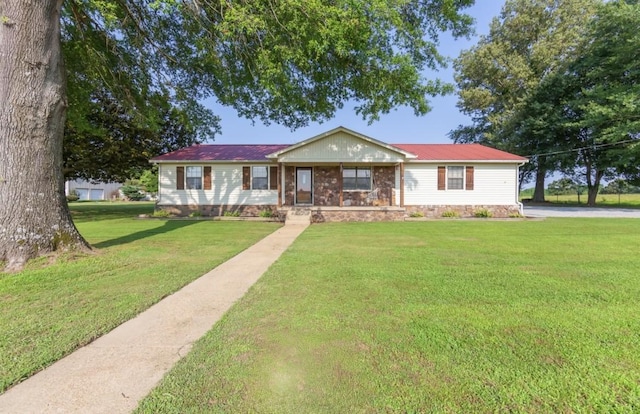 235 Pinecrest Dr, Henderson, TN 38340 - single story home featuring a front yard and metal roof