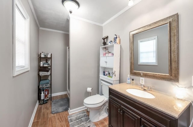 235 Pinecrest Dr, Henderson, TN 38340 - bathroom with vanity, crown molding, toilet, wood finished floors, and baseboards