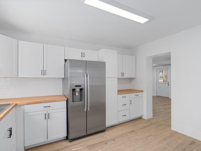 400 Westover Dr, Columbia, TN 38401 - kitchen with stainless steel refrigerator with ice dispenser, butcher block counters, white cabinets, light wood finished floors, and backsplash