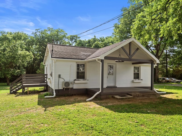 400 Westover Dr, Columbia, TN 38401 - bungalow with roof with shingles, a front yard, a cooling unit, a wooden deck, and a porch