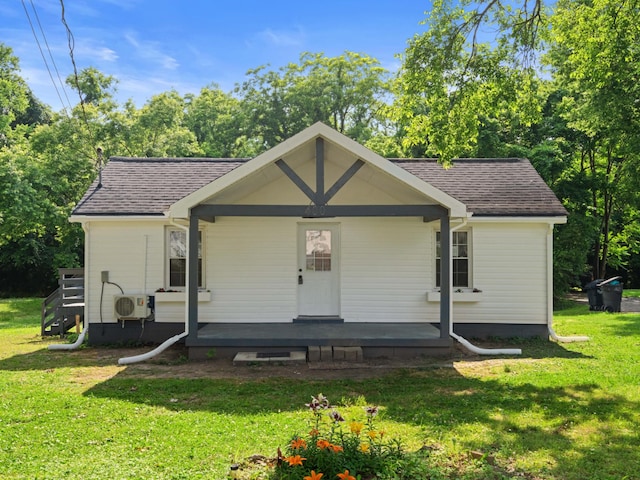400 Westover Dr, Columbia, TN 38401 - view of front of property featuring covered porch, roof with shingles, a front lawn, a cooling unit, and view of scattered trees