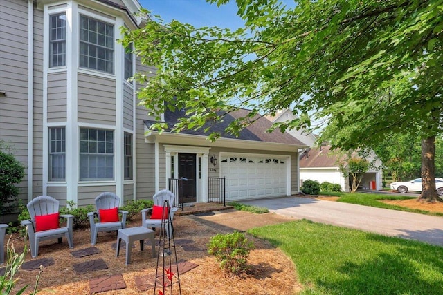1284 Heritage Landing Dr, Chattanooga, TN 37405 - view of front of home with a garage, driveway, and roof with shingles